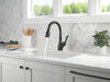 Llave para cocina extensible de una manija con tecnología ShieldSpray®