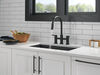 Llave para cocina tipo puente extensible con dos manijas