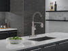 Llave para cocina extensible de una manija con tubo de salida con muelle