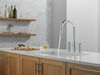 Llave para cocina tipo puente extensible con dos manijas