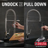 Llave para cocina extensible de una manija con tubo de salida con muelle