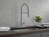 Llave para cocina extensible de una manija con tubo de salida con muelle