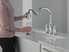 Llave para cocina tipo puente extensible con dos manijas