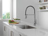 Llave para cocina extensible de una manija con tubo de salida con muelle