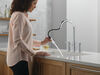 Llave para cocina tipo puente extensible con dos manijas