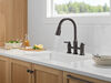 Llave para cocina tipo puente extensible con dos manijas