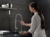 Llave para cocina extensible de una manija con tubo de salida con muelle