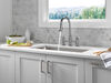 Llave para cocina tipo puente extensible con dos manijas